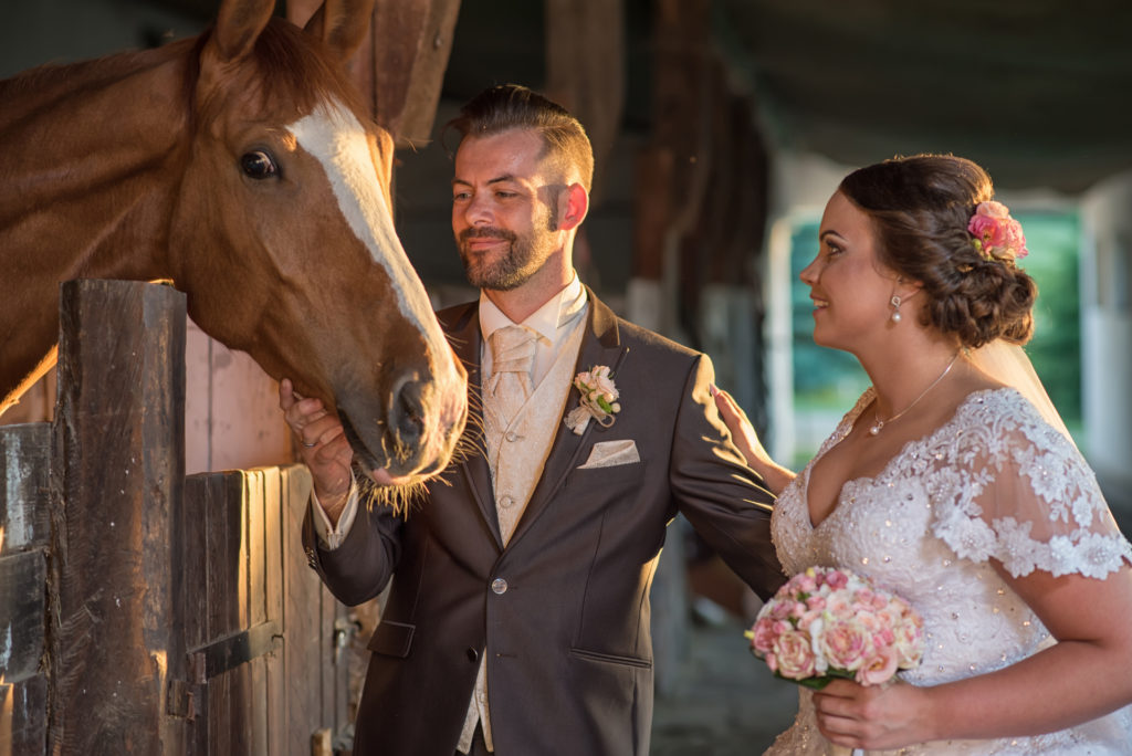 Beautiful young couple with horses